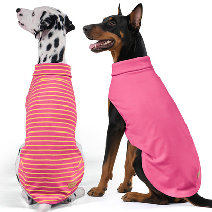 Two dog sweaters: pink striped sleeveless turtleneck and solid pink sleeveless turtleneck