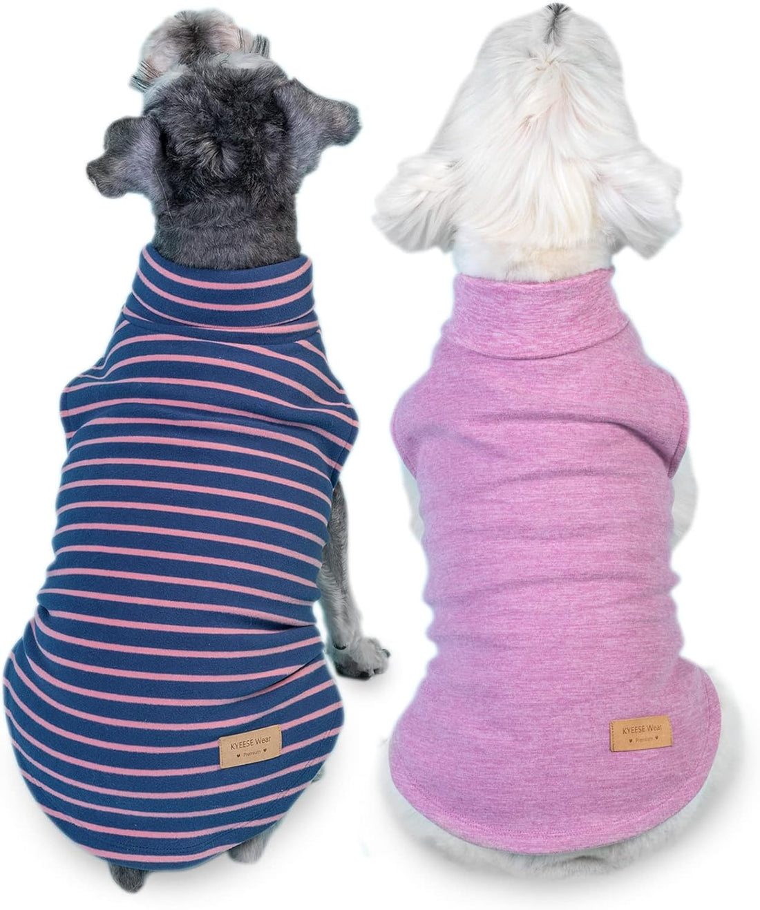 Two sleeveless dog sweaters: striped navy-red and solid pink turtleneck with belly cutouts