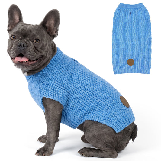 Gray French bulldog seated in sky blue knit pullover beside sweater back view