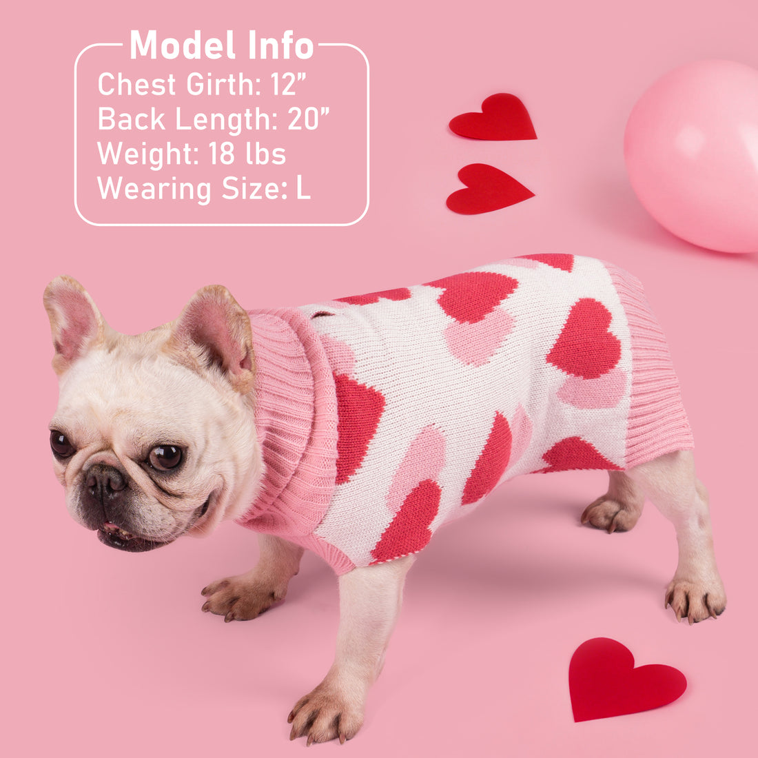 Pink-and-white dog sweater with red heart knit pattern and ribbed collar