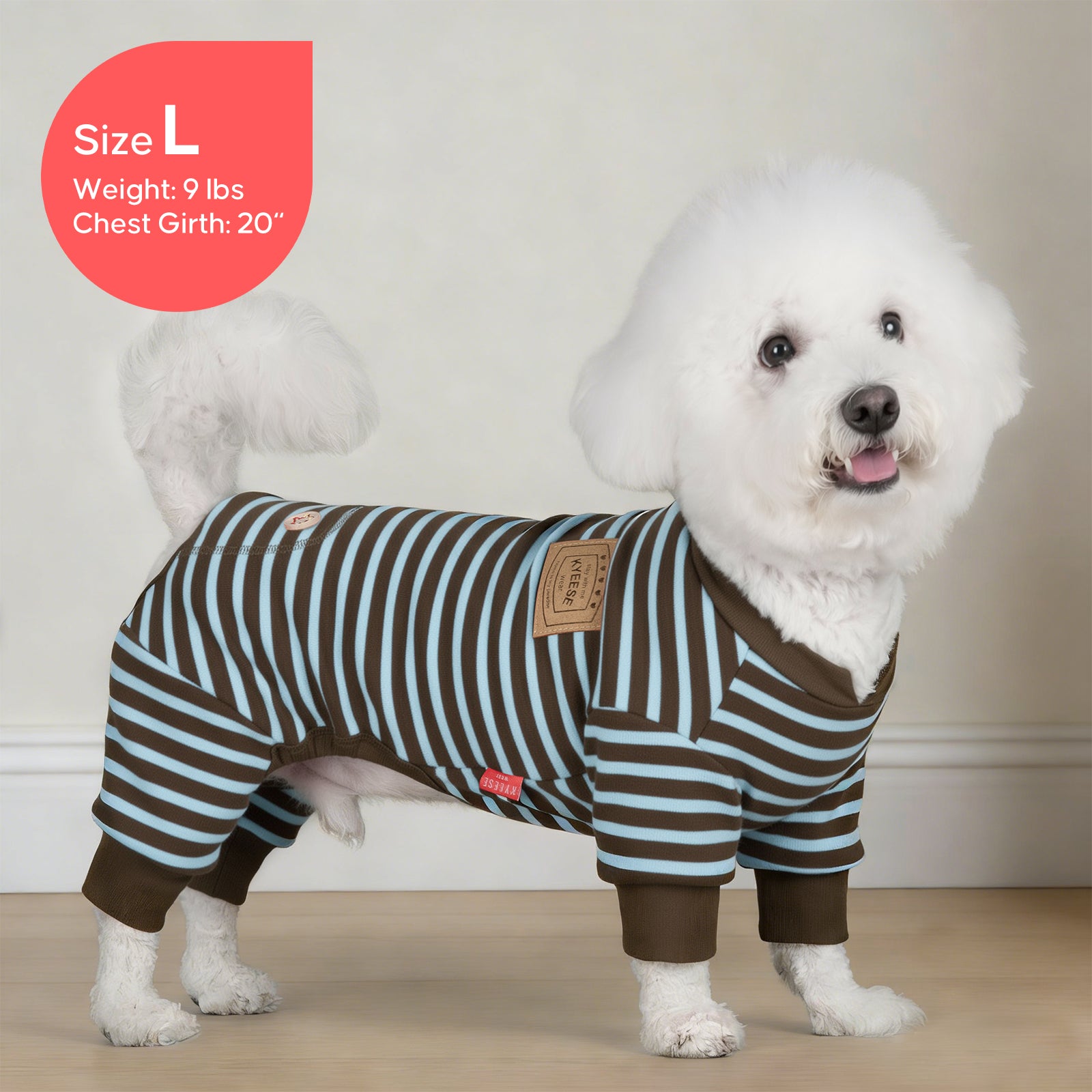 Striped dog onesie pajamas on a white dog, blue and brown stripe pattern