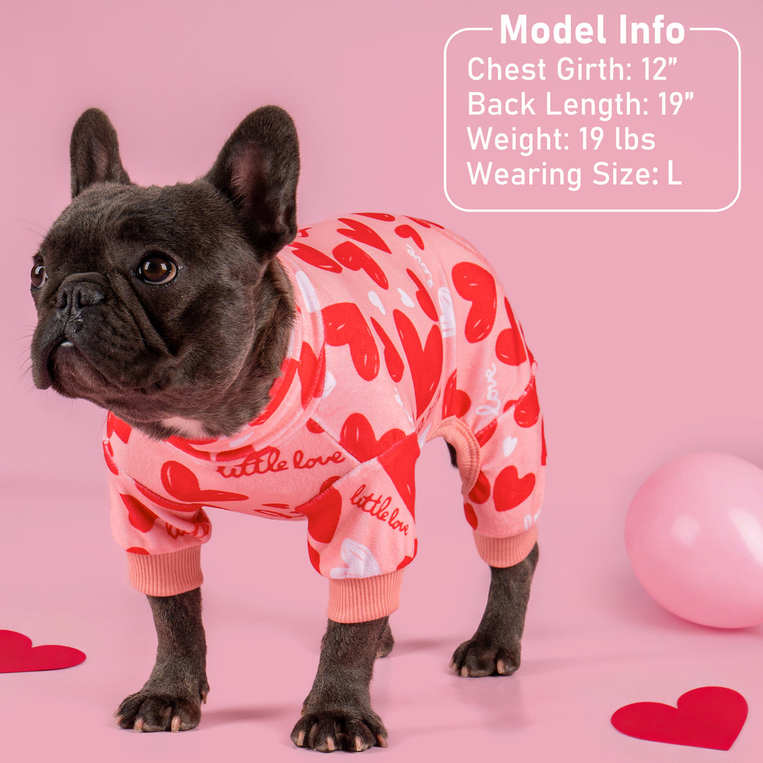 Heart-pattern dog onesie pajama with pink ribbed collar and sleeve cuffs