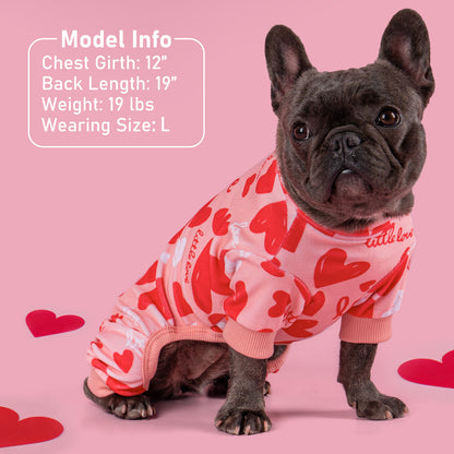 Red-and-white heart dog onesie pajama with pink ribbed neck and leg openings