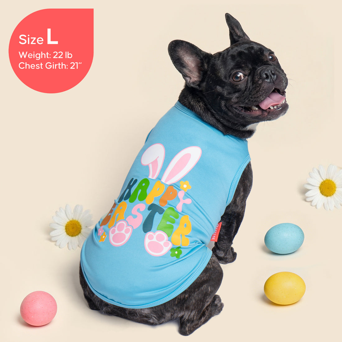 Sleeveless Easter dog shirt in light blue with "Happy Easter" graphic and paw prints, on dog.