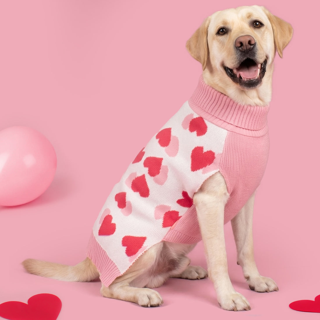 Dog sweater in pink and white with red heart motifs and ribbed turtleneck