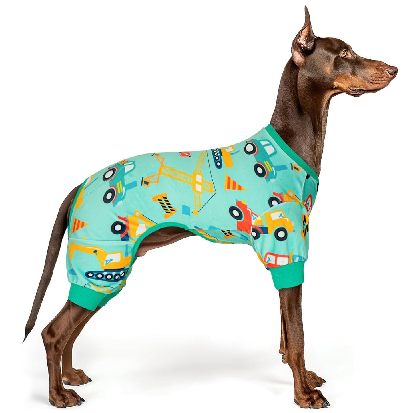 Teal construction-print dog onesie pajamas with ribbed cuffs and tail opening.