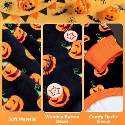 Dog pajama fabric close-up with orange pumpkin print, orange elastic cuffs, and buttons