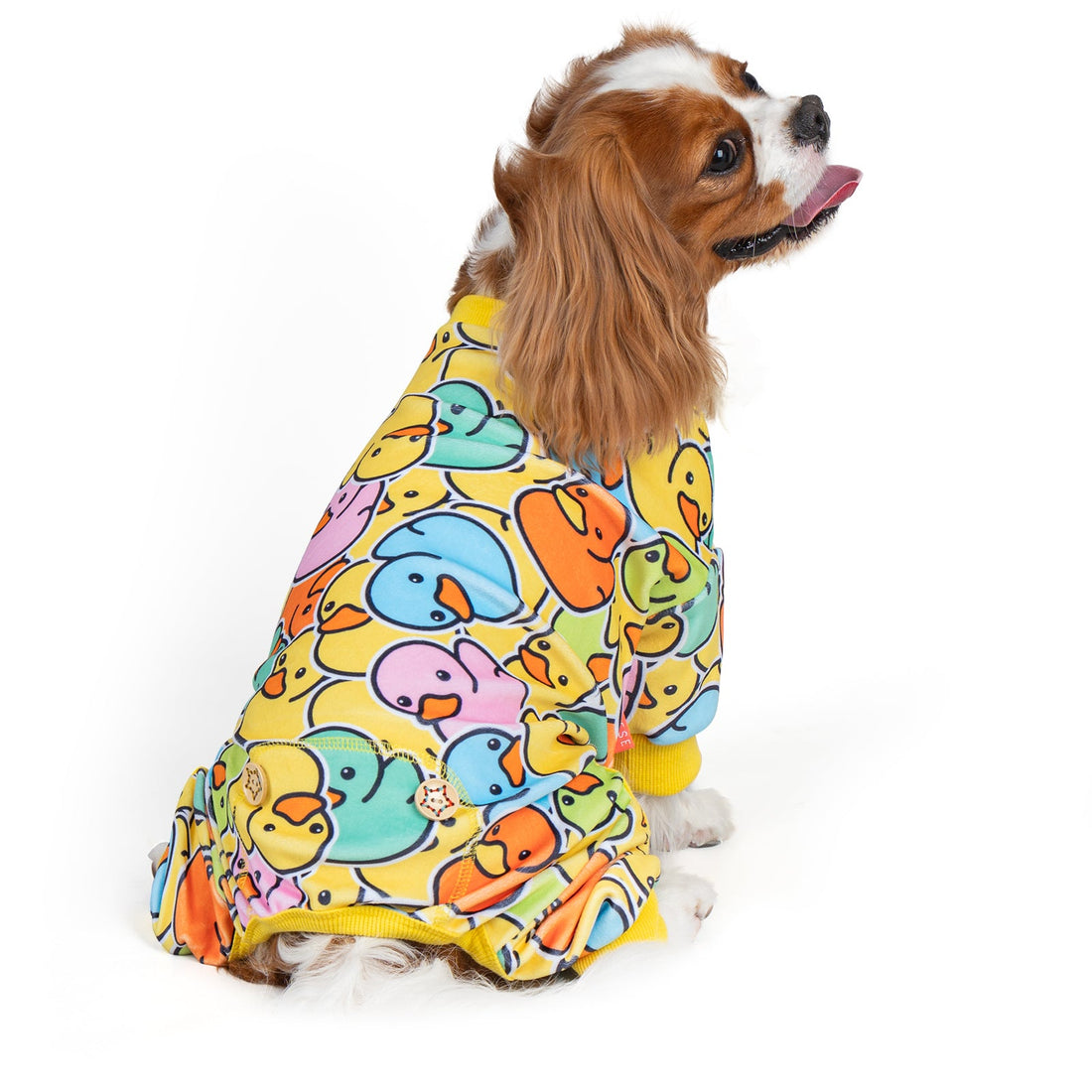 Dog onesie pajamas with colorful duck print and yellow cuffs, front view