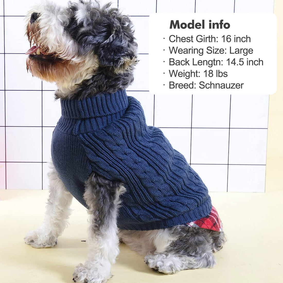 Dark navy cable knit dog turtleneck sweater with plaid hem detail