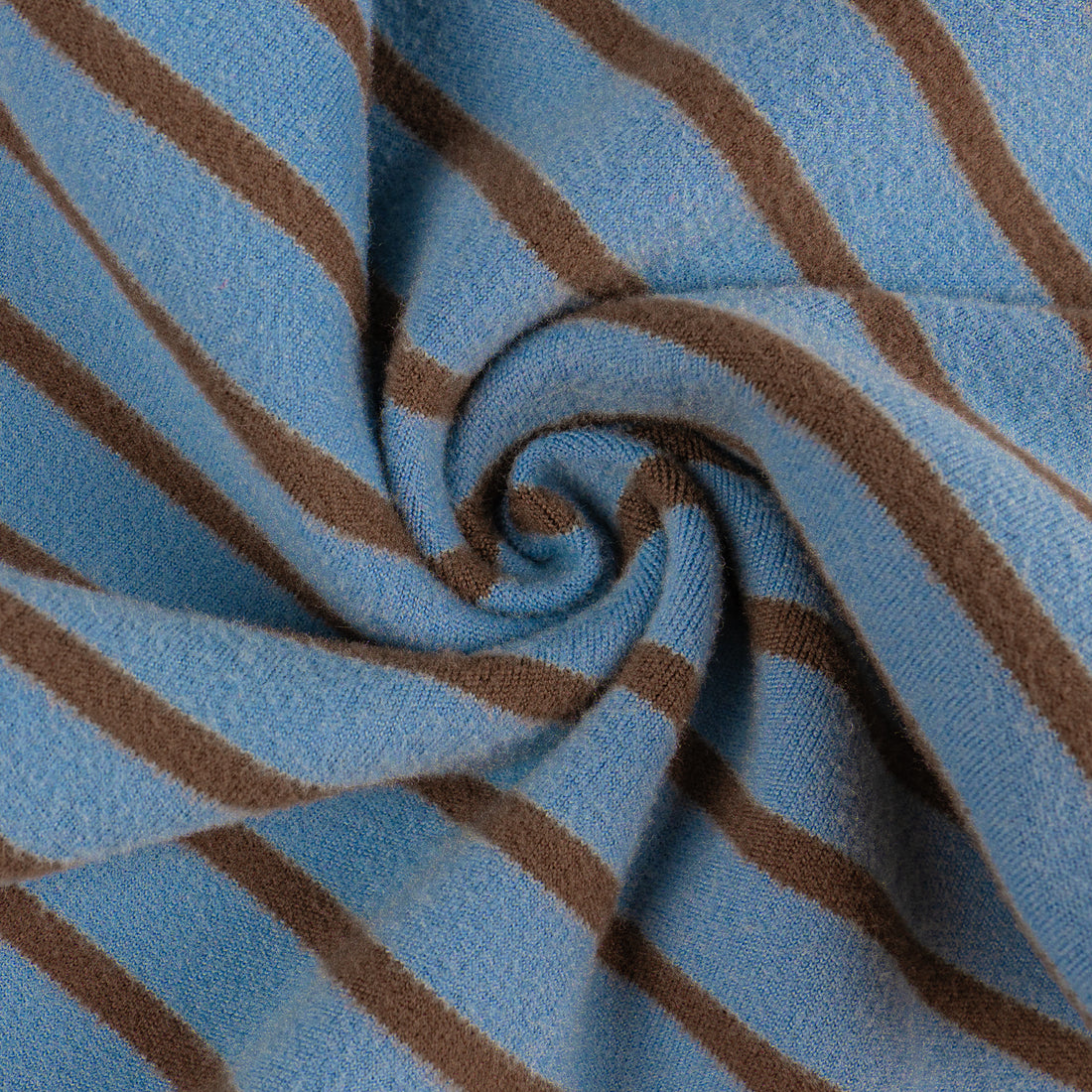 Close-up of blue and brown horizontal striped knit fabric