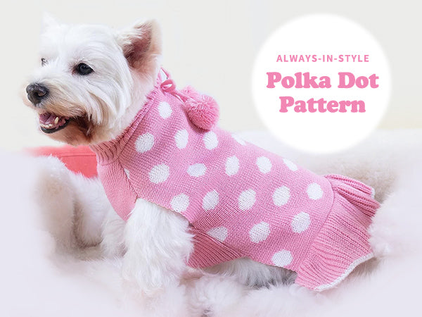 Pink dog sweater dress with white polka dots and pom pom bow detail.