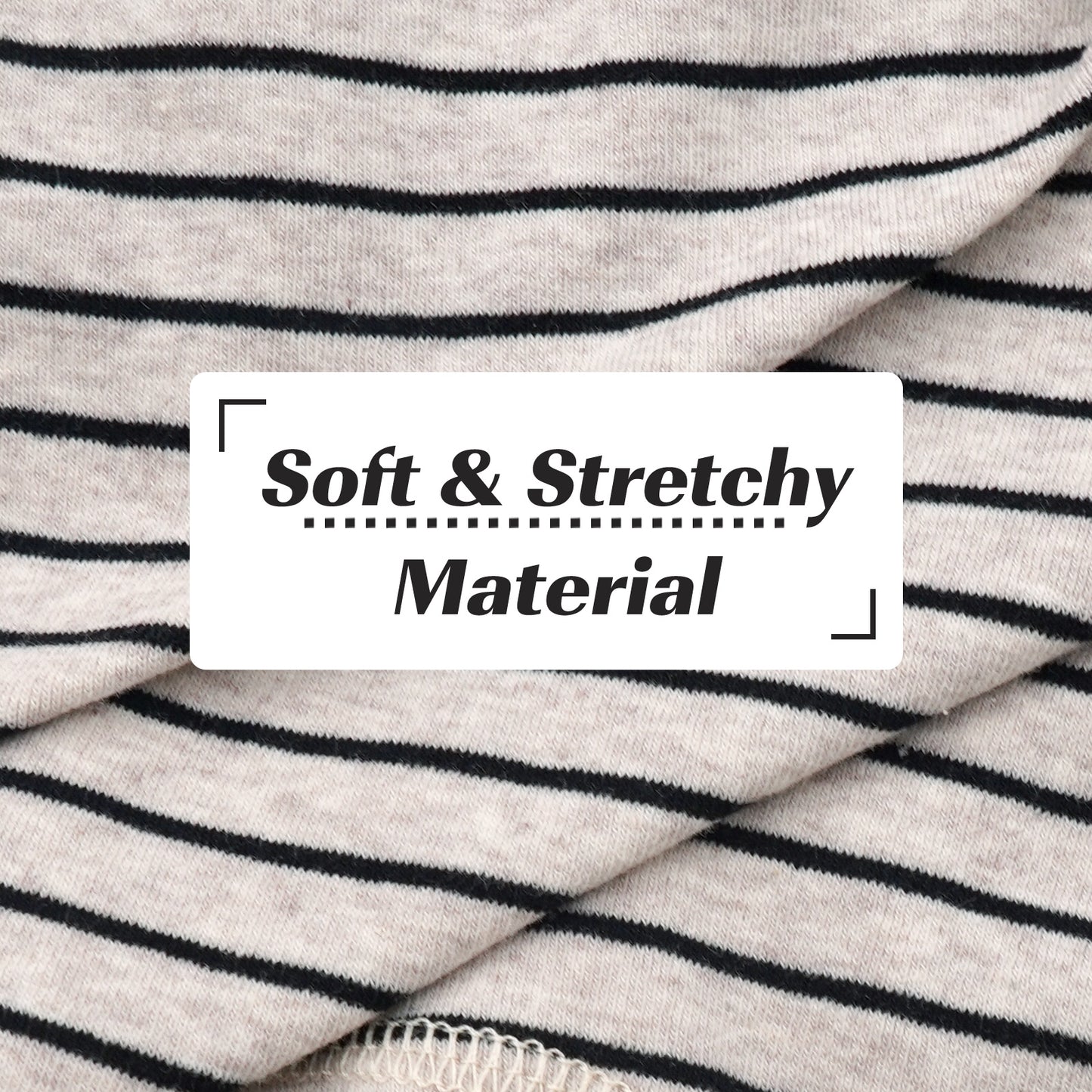 Striped dog onesie fabric close-up, soft knit with black horizontal stripes