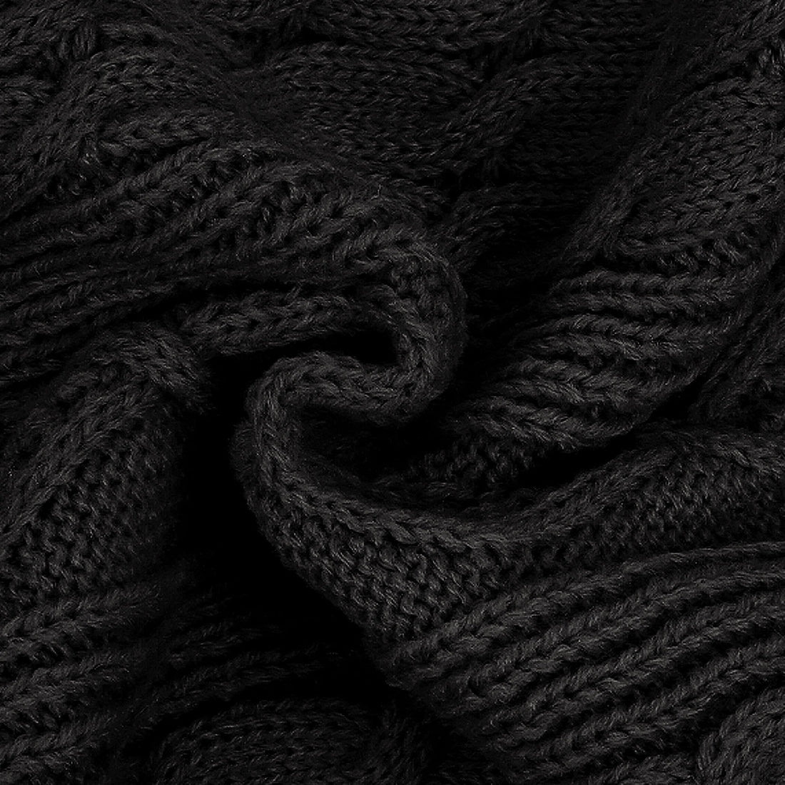 Black cable knit sweater texture with braided stitch detail