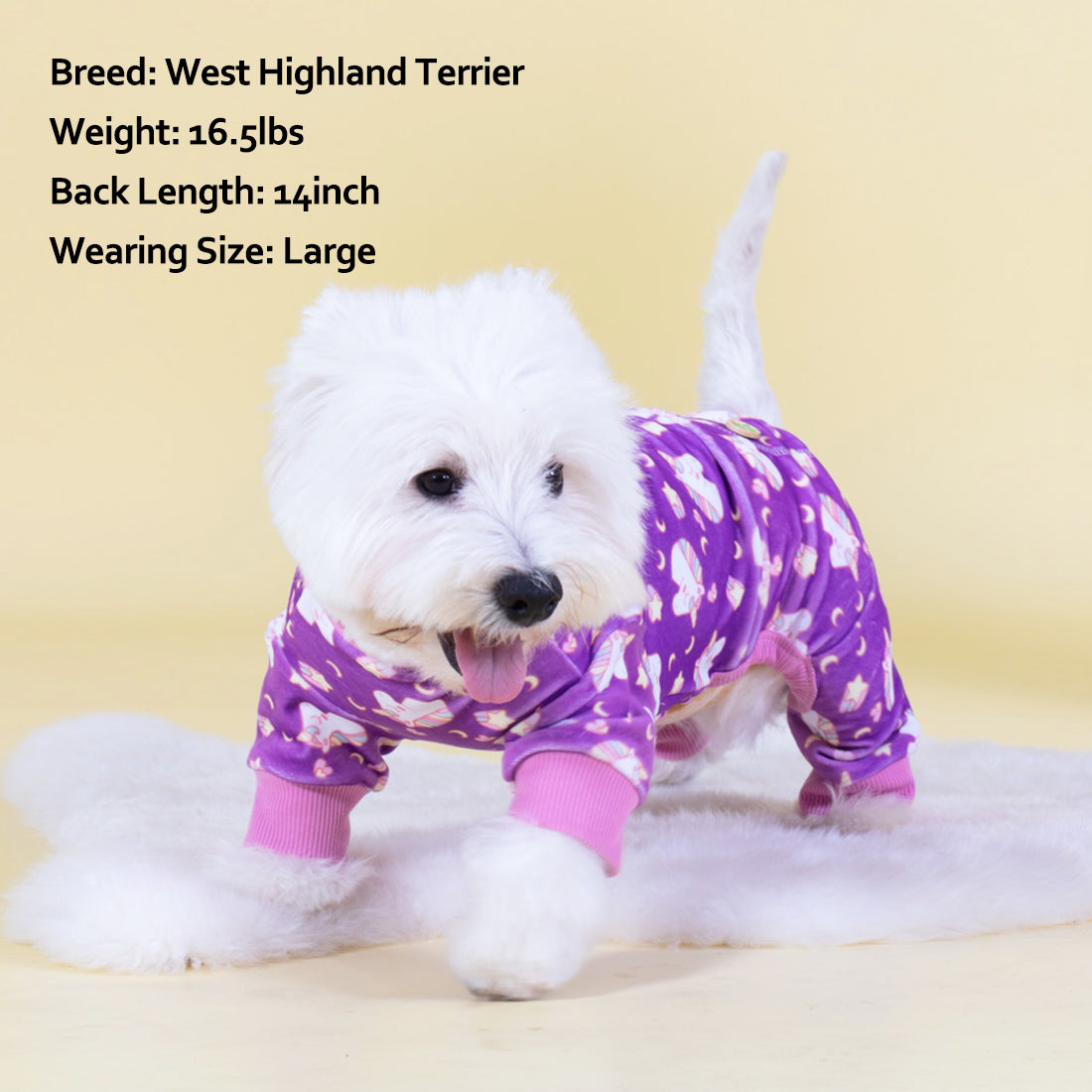 Purple dog unicorn onesie pajamas on a white dog with pink ribbed cuffs.