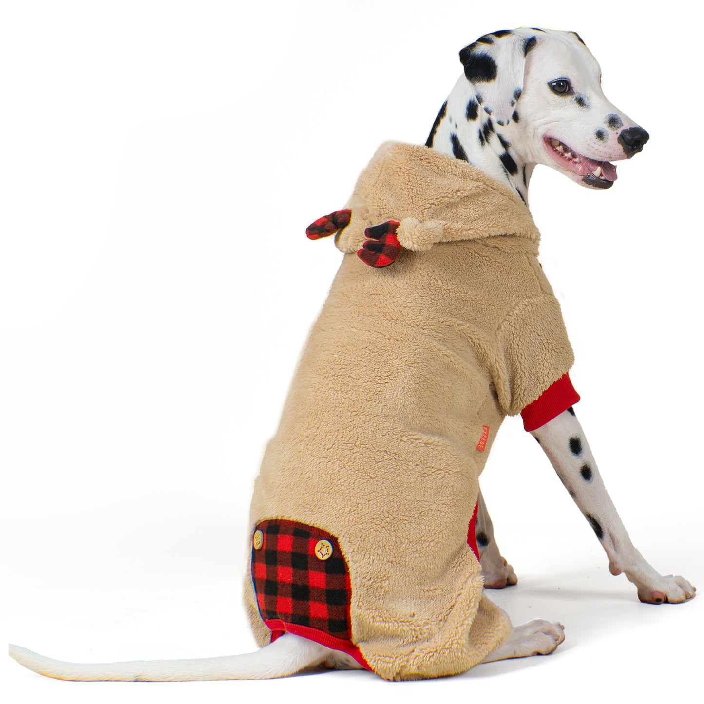 Tan fleece dog onesie with reindeer antler hood, red cuffs, and plaid pocket