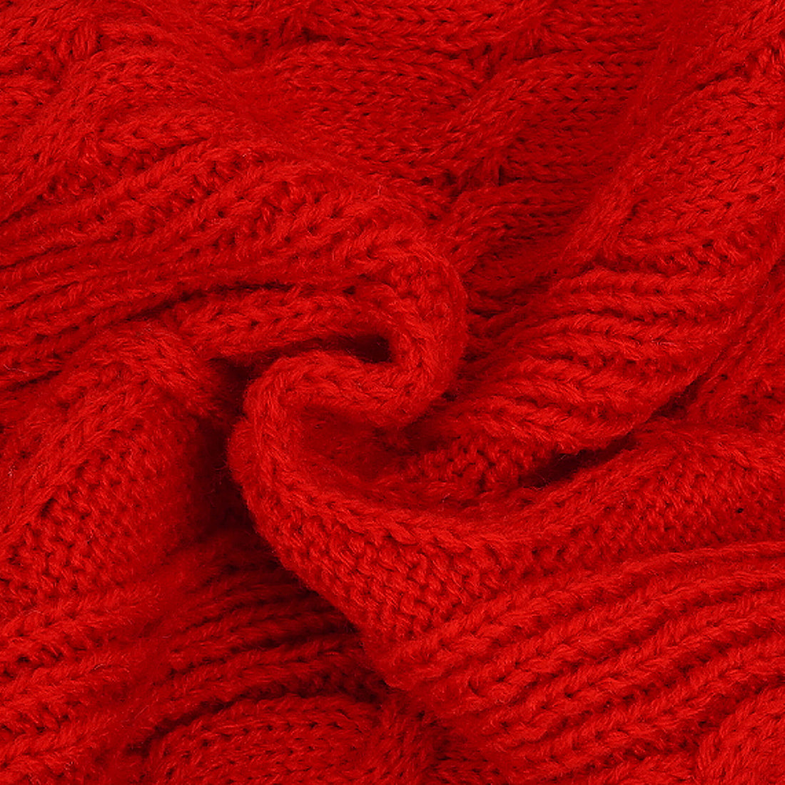 Red cable knit sweater fabric close-up with raised interlaced pattern