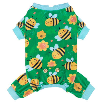 Green dog onesie pajamas with bee and flower print, front view, light blue trim on legs.