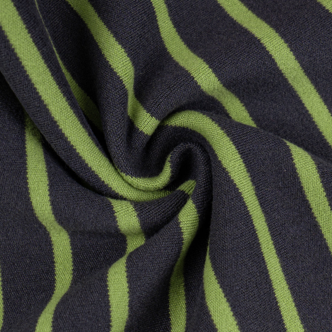 Striped thermal dog pajamas fabric close-up in dark and lime green stripes
