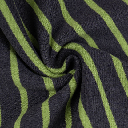 Striped thermal dog pajamas fabric close-up in dark and lime green stripes
