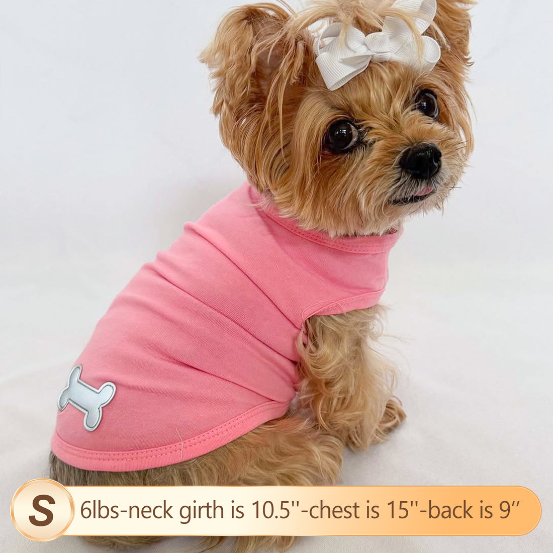 Solid pink sleeveless lightweight dog shirt with dog-bone patch detail