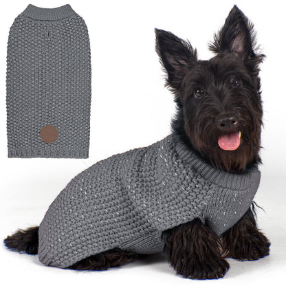 Grey knit dog sweater with round neck and small patch, worn by a dog