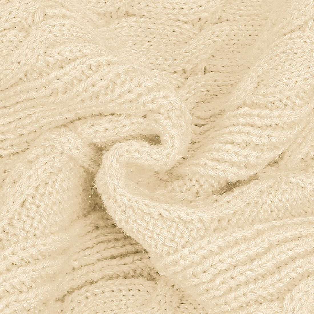 Cream cable-knit dog sweater fabric texture close-up