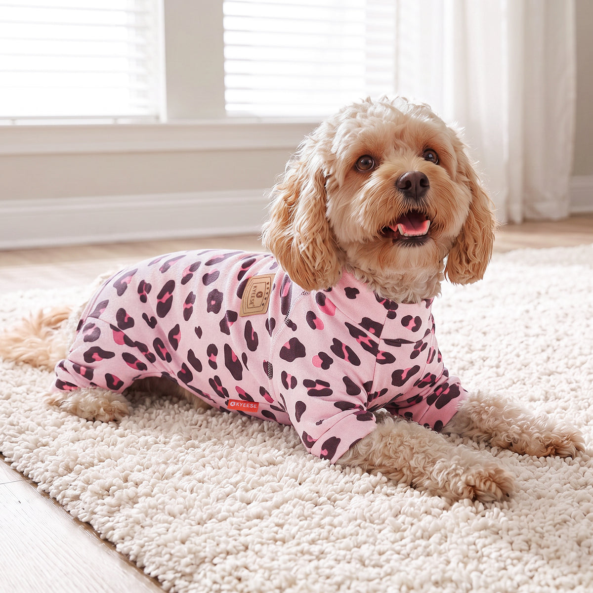 Pink Leopard Turtleneck Dog Onesie Pajamas, small dog resting on a rug in the pajamas