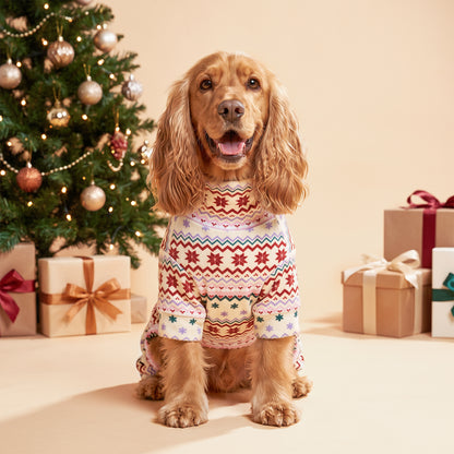 Pink Snowflake Dog Christmas Pajamas, cream and pink Fair Isle snowflake pattern, dog wearing the pajamas in a holiday or home setting