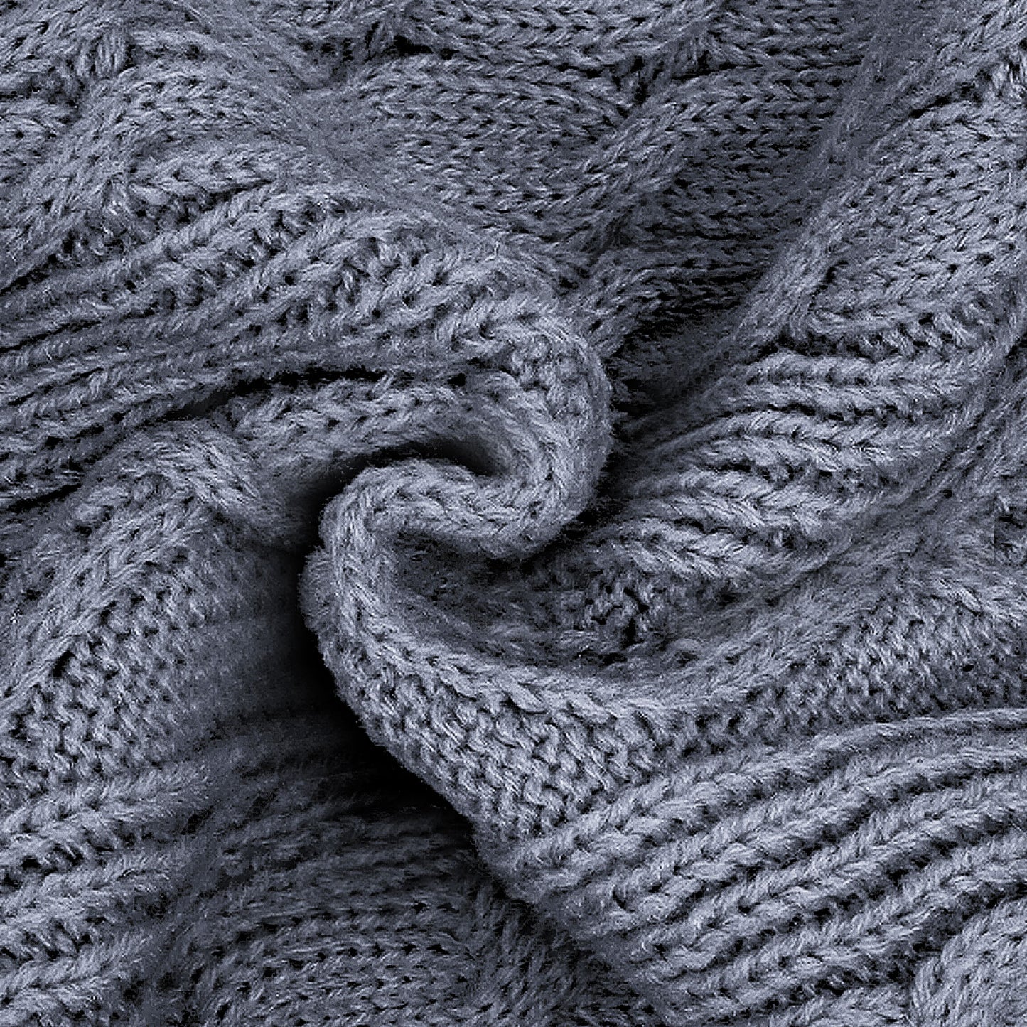 Gray cable knit dog sweater fabric close-up with twisted cable texture