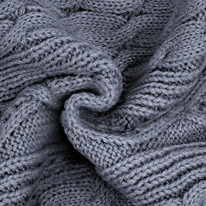 Gray cable knit dog sweater fabric close-up with twisted cable texture