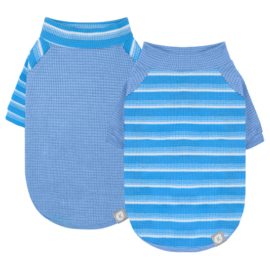 Two waffle knit dog shirts laid flat, one solid light blue and one blue striped raglan style