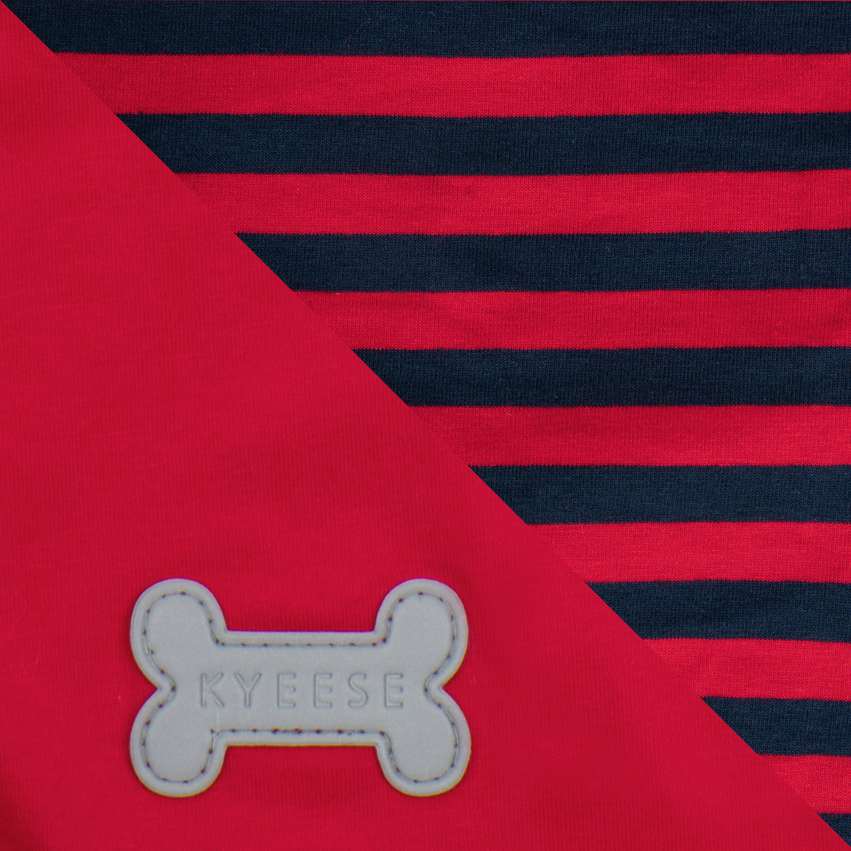 Close-up of navy stripes on red fabric and reflective bone logo