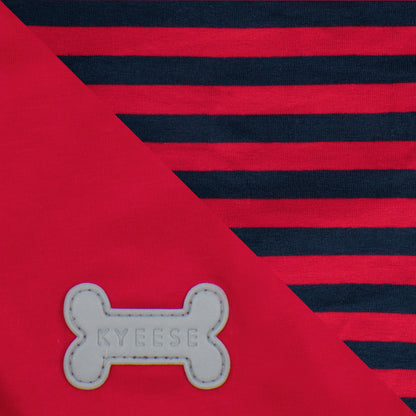 Close-up of navy stripes on red fabric and reflective bone logo