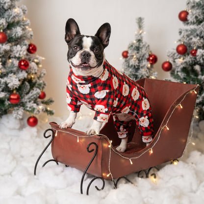 Santa Buffalo Plaid Dog Christmas Pajamas, Santa faces on red and black buffalo plaid, dog wearing the pajamas in a holiday or home setting